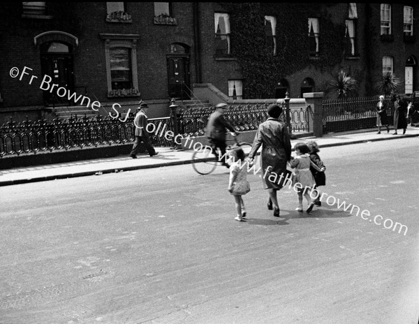 CHILDREN WITH MOTHER CROSSING STREET RATHMINES ROAD